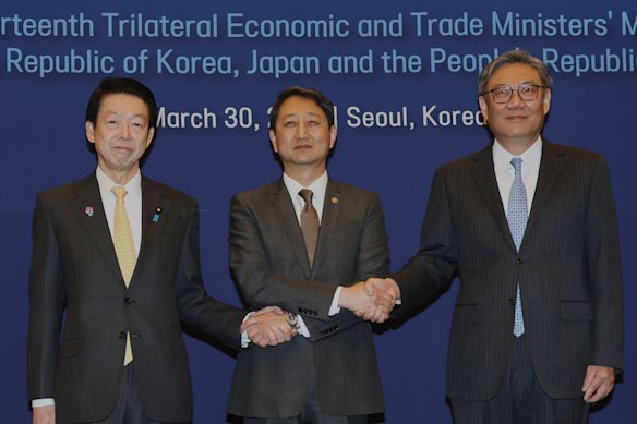 South Korean Industry Minister Ahn Duk-geun, Japanese Trade Minister Yoji Muto and Chinese Commerce Minister Wang Wentao after meeting in Seoul.