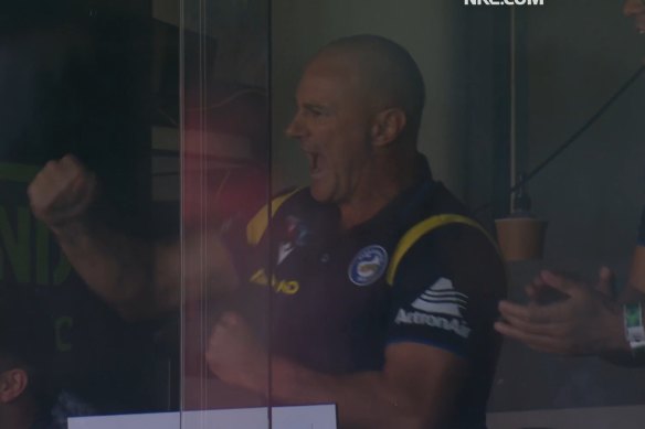 Brad Arthur pumps a fist after son Jakob scores on debut for Parramatta.