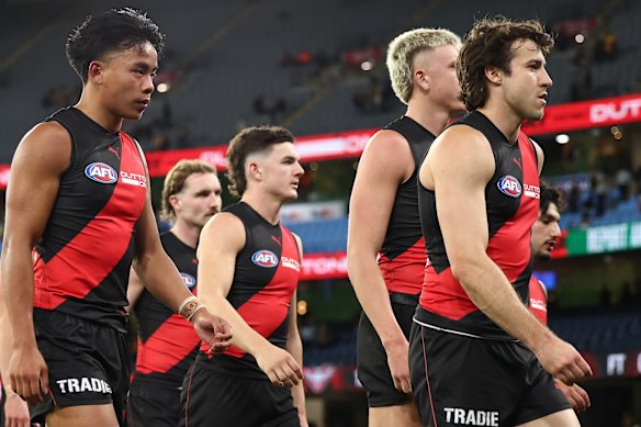 Andrew McGrath leads his team off the ground.