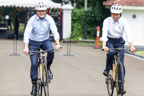 Prime Minister Anthony Albanese and President of Indonesia Joko Widodo cycle through Bogor Palace in Indonesia.