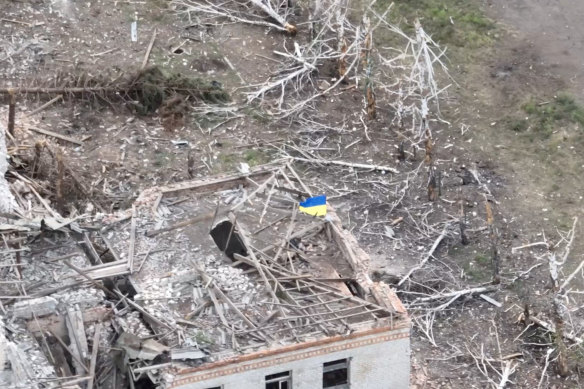 Ukrainian forces raise the national flag in Robotyne, Zaporizhzhia region.