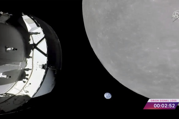 NASA’s Orion capsule, left, nearing the moon, right. At centre is Earth.