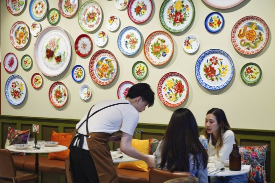 R.Harn’s walls feature dozens of plates that are used for Lunar New Year celebrations by families in Thailand.