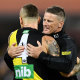 Damien Hardwick embraces Dustin Martin after the grand final in 2020.