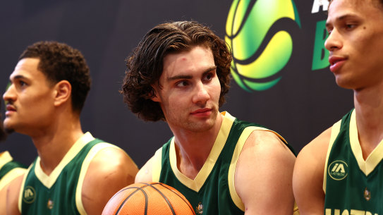 Australian Boomers player Josh Giddey, middle, attends an in-store appearance at Footlocker QV on Friday with Josh Green, left, and Dyson Daniels, right.