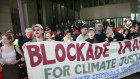Protesters outside a mining conference in Melbourne this week: good regulation can protect the environment and economy. 