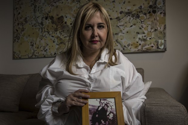 Judith Aronovitch holds pictures of her mother Luba.