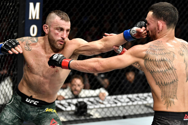 Volkanovski became world UFC featherweight champion after defeating American Max Holloway (right) in 2019.