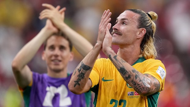 Socceroos midfielder Jackson Irvine celebrates with the crowd.