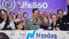 Chris Hulls, centre, as Life360 makes its public market debut in New York.