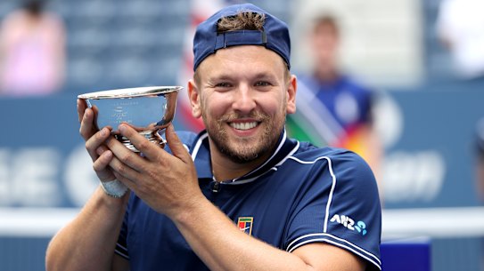 Dylan Alcott celebrates after defeating Niels Vink at the US Open to complete a golden grand slam.