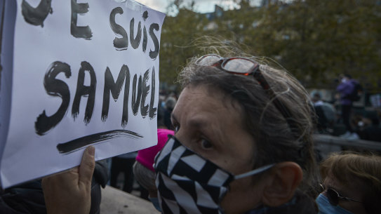 A protestor holds a 'Je Suis Samuel' placard during an anti-terrorism vigil at Place de La Republique.