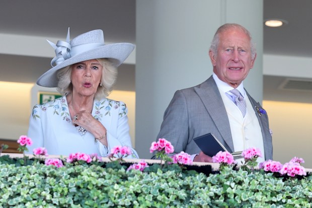 ASCOT, ENGLAND - JUNE 16: Queen Camilla and King Charles III react as they attend day one of Royal Ascot 2026 at Ascot Racecourse on June 16, 2026 in Ascot, England. (Photo by Chris Jackson/Getty Images)