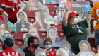 Fans sit in the stands among cardboard cutouts before Super Bowl LV between the Tampa Bay Buccaneers and the Kansas City Chiefs at Raymond James Stadium on Sunday, local time.