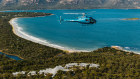 Just a 30-minute flight from Hobart, the distinctive ray-shaped profile of Saffire Freycinet looks out across Great Oyster Bay and the Hazards. 