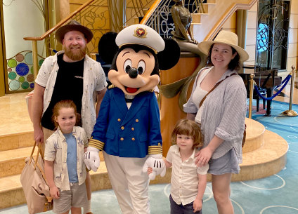 Ben Groundwater and family, plus Mickey Mouse, on board the Disney Wonder.