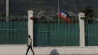 he Haitian flag flies at half-mast at the Presidential Palace in Port-au-Prince, Haiti, on Saturday.