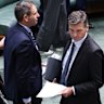 Treasurer Dr Jim Chalmers and Opposition Leader Angus Taylor walk past each other during a division on Thursday.