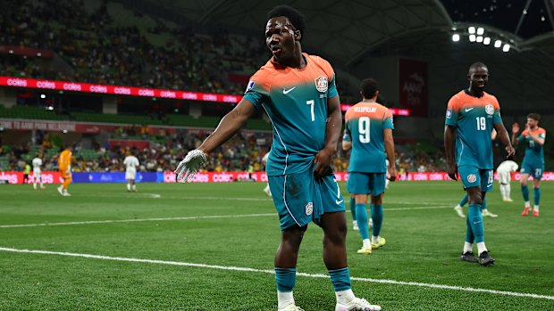 Nestory Irankunda of Australia throws on a silver glove and performs a Michael Jackson dance after scoring on Tuesday night.