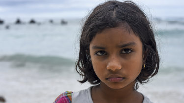 Sri Lankan refugee Sakinthana, 8, at the beach on Nauru.