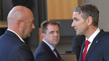 AfD parliamentary party leader Bjoern Hoecke, right, shakes hands with Thomas Kemmerich of the Free Democrats, in Erfurt, Germany.