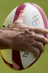 A member of Australiaâ€™s menâ€™s rugby sevens team holds a ball during   a practice session in Tokyo.