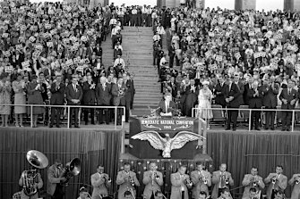 July 15, 1960: Senator John F. Kennedy gets a standing ovation as he steps up to accept the Democratic Party's nomination for president during a Los Angeles Coliseum rally.