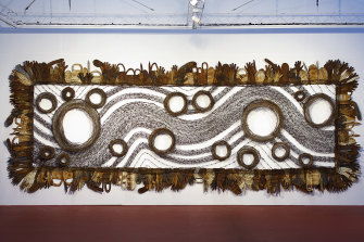 Lorraine Connelly-Northey, Possum-Skin Cloak: Blackfella Road, 2011-2013.
rusted iron and tin, fencing and barbed wire, wire 268.5 × 703.0 cm irreg.
