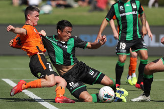 Western United's Tomaki Imai, centre, in action during round 19. 