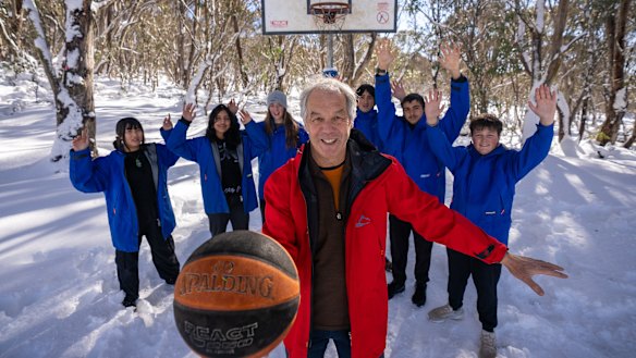 The Alpine School campus principal Russell Shem plays ball with students.