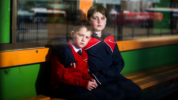 Elijah Sham, 7, and Noah Sham, 10, at the Woden Bus Interchange.