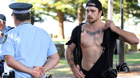 Scuffle: Photographer Dylan Robinson was left with a torn shirt.