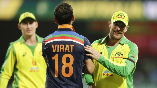 Kohli congratulates Finch after Australia's victory. 