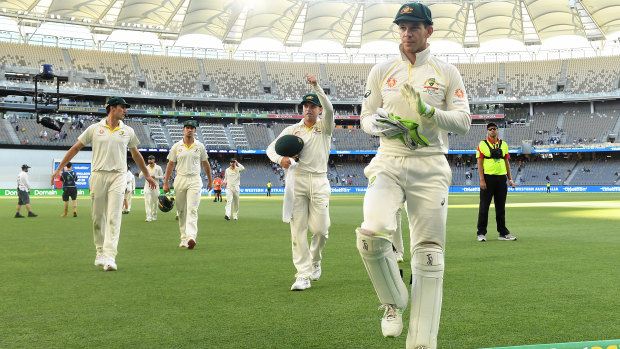 Tim Paine leads the Australians off the field on day four.