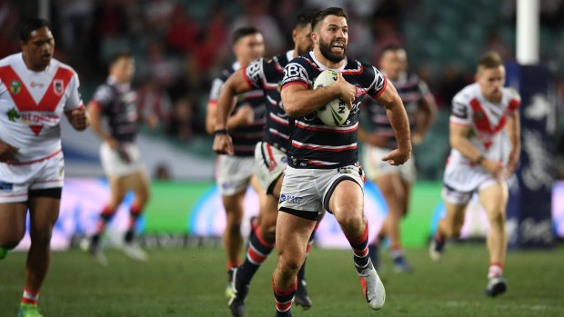 Daylight second: James Tedesco breaks clear against a spluttering Dragons at Allianz Stadium.