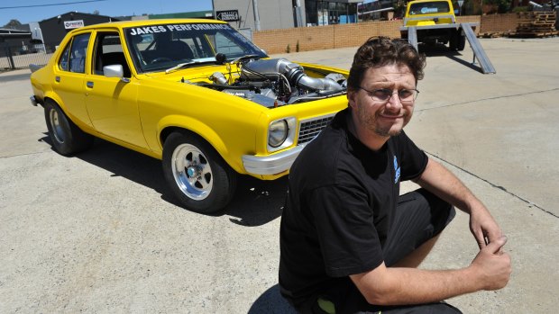Performance mechanic Jake Edwards with his highly modified L J Torana in 2013.