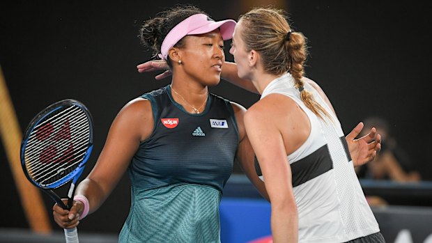 The finalists embrace after the match on Rod Laver Arena.