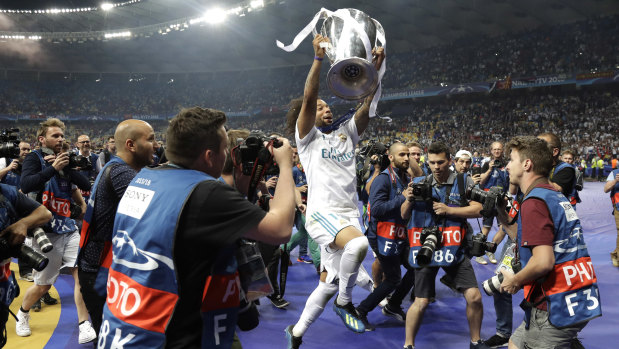 Real Madrid's Marcelo celebrates with the trophy after winning the Champions League Final between Real Madrid and Liverpool at the Olimpiyskiy Stadium in Kiev, Ukraine, on Saturday.