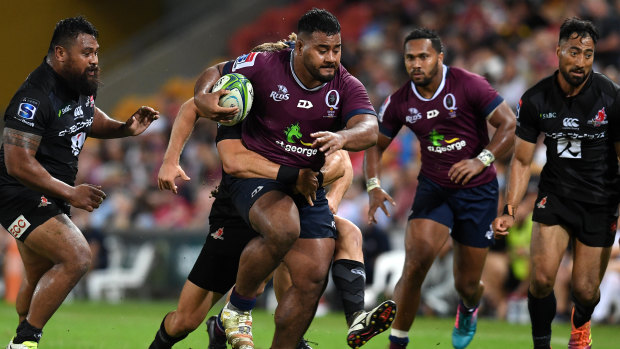 Taniela Tupou (centre) in action for the Reds.