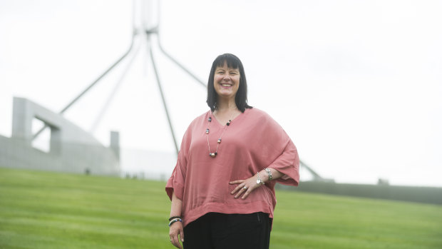 Caddie Rees outside Parliament House, where she will attend a national apology to people who experienced institutional child sexual abuse on Monday.