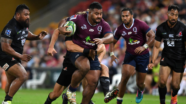 Taniela Tupou of the Reds (centre) in action during the round 12 match at Suncorp Stadium on Friday.