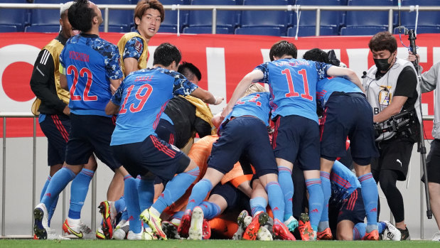 Japan celebrate their win over Australia in the world cup qualifier in Tokyo