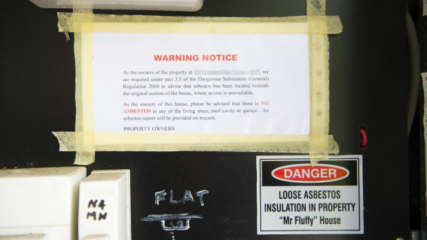 Lorraine Carvalho has placed her own Mr Fluffy warning notice in the electricity meter box at her home, informing visitors that there is no Mr Fluffy contamination in the living areas.