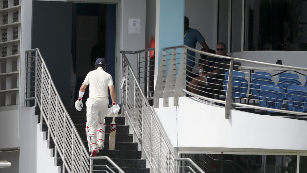 Lonely walk: Joe Root leaves the field after being dismissed.
