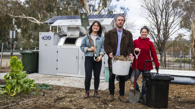 Events and projects manager Gaby Ho, director Ryan Lungu, garden coordinator Karina Bontes Forward next to their new public composter at the Canberra Environment Centre.
