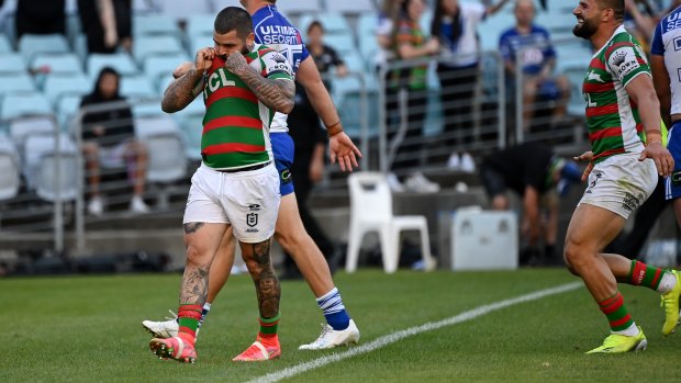 Adam Reynolds kisses the badge after scoring a try in the Good Friday clash against the Bulldogs last week.