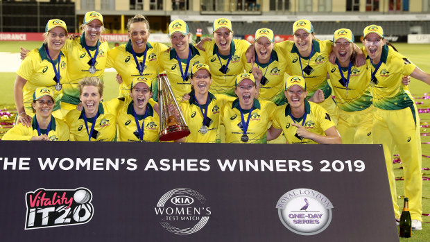Ashes winners: Australia celebrate after retaining the urn.