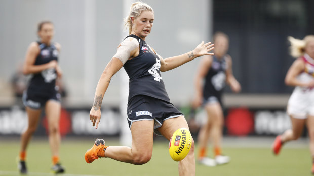 On target: Carlton's Tayla Harris puts the boot into an attempt on goal during the round 6 clash against Brisbane at Ikon Park in Melbourne.