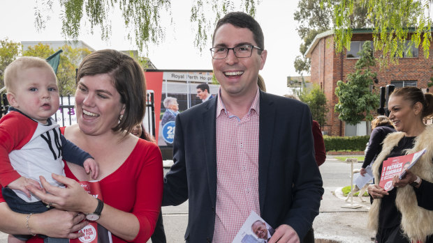 Labor candidate for Perth Patrick Gorman arrives at Highgate polling station on Saturday with his wife Jess and their son Leo.