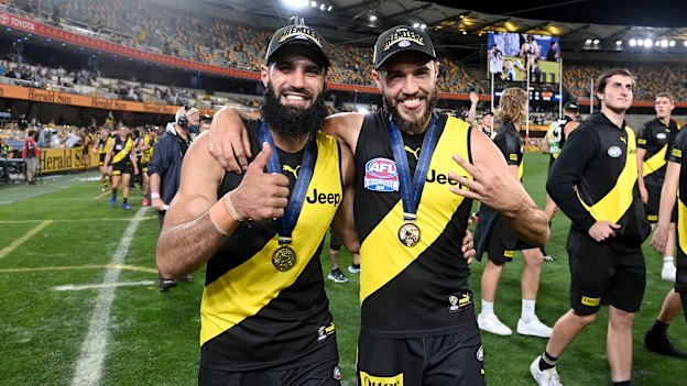Bachar Houli and Shane Edwards celebrate victory after the 2020 AFL grand final.
